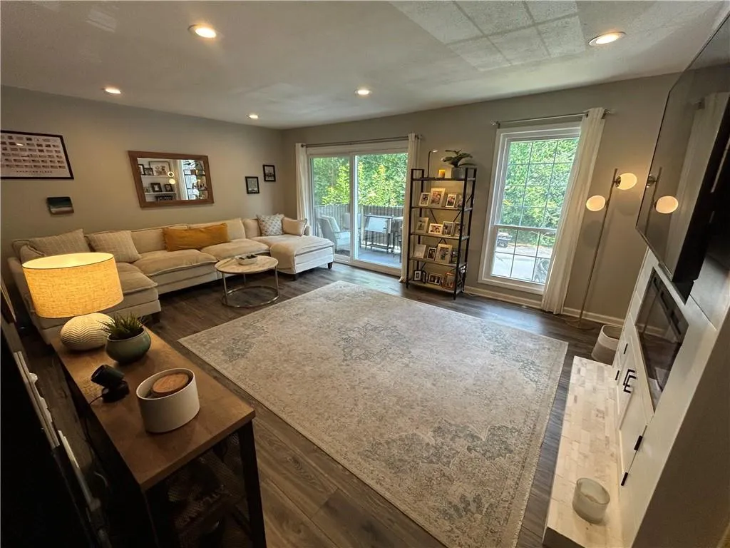 Dining room with baseboards and dark wood-type flooring