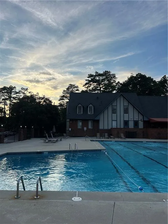 Uncovered parking lot with a community pool