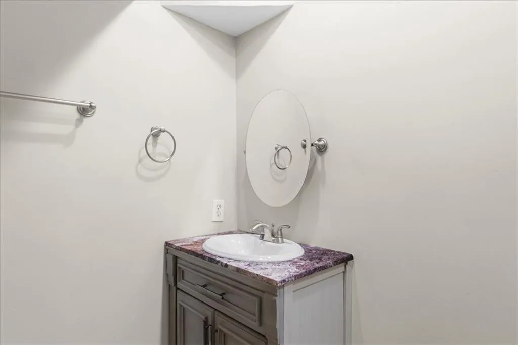 Bathroom featuring vanity Bathroom featuring vanity