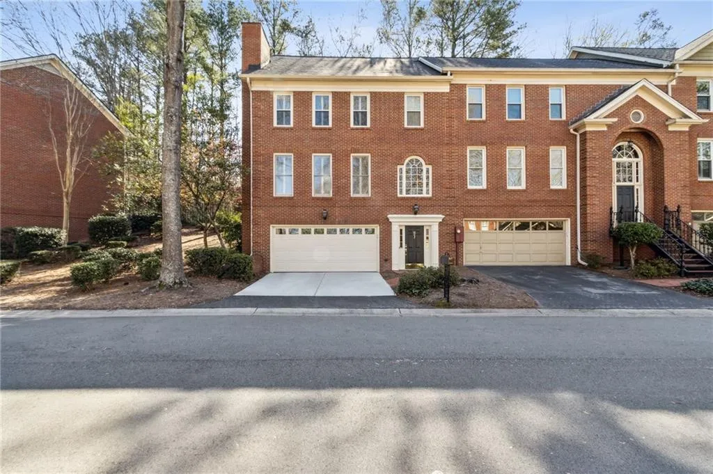 View of property featuring a garage