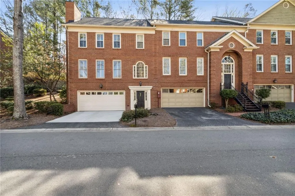 View of property with a garage