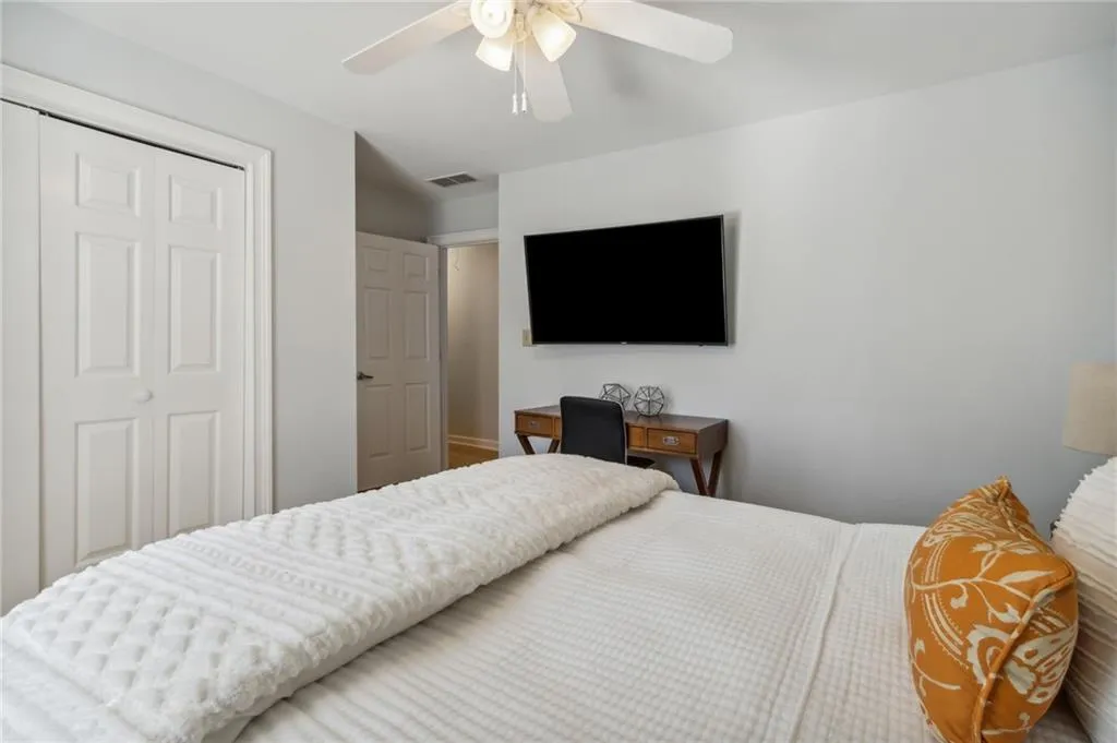 Bedroom featuring a closet and ceiling fan