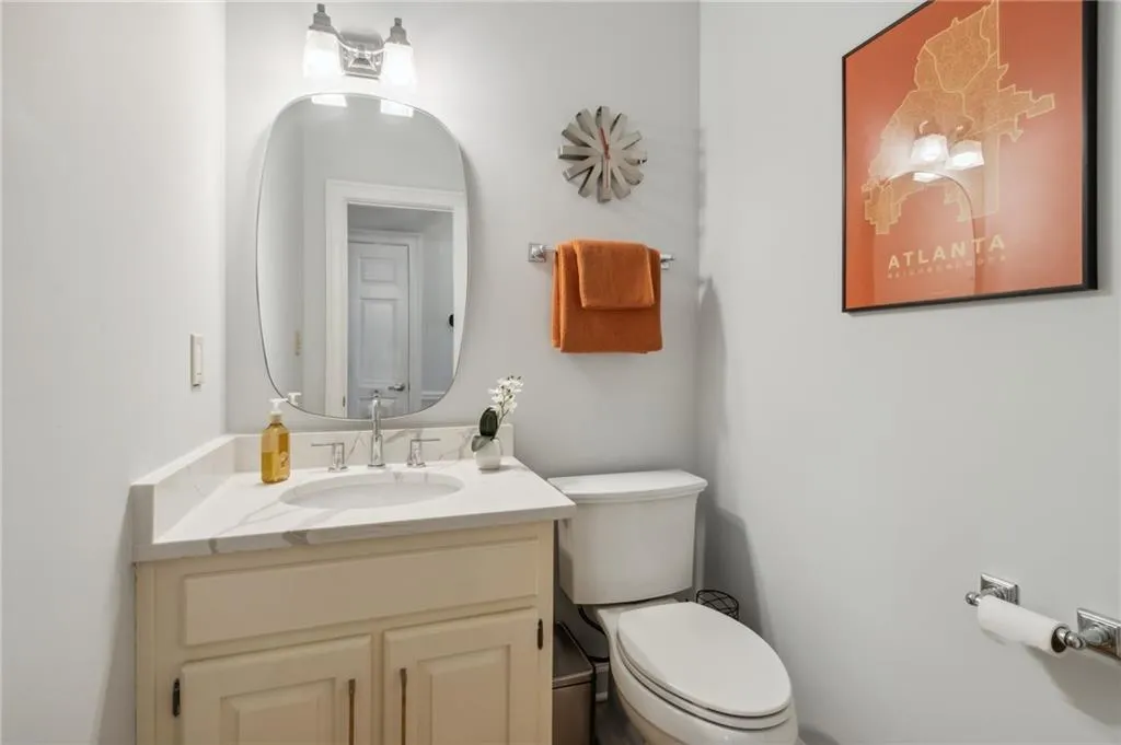 Bathroom featuring toilet and oversized vanity