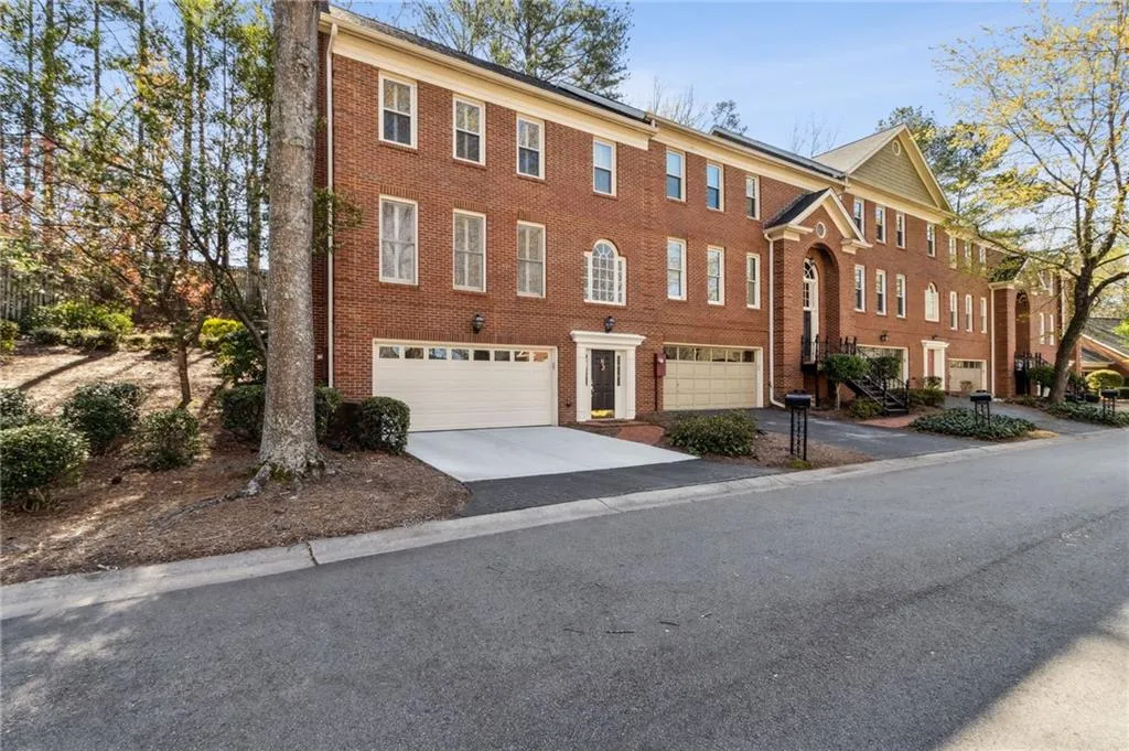 View of property featuring a garage