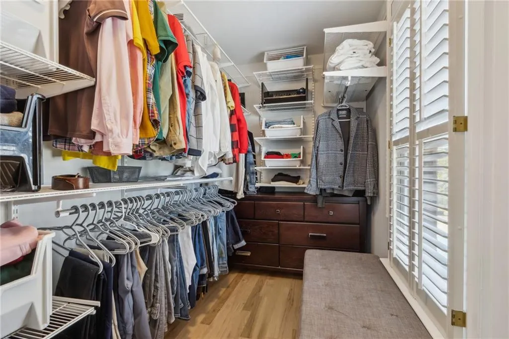 Walk in closet featuring light hardwood / wood-style floors