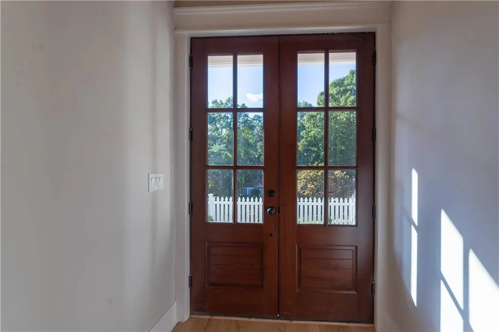 Doorway to outside featuring light hardwood / wood-style floors and french doors