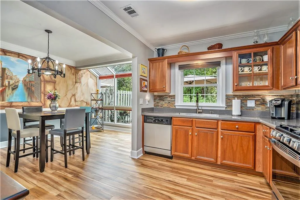 Kitchen opens to dining and rear deck