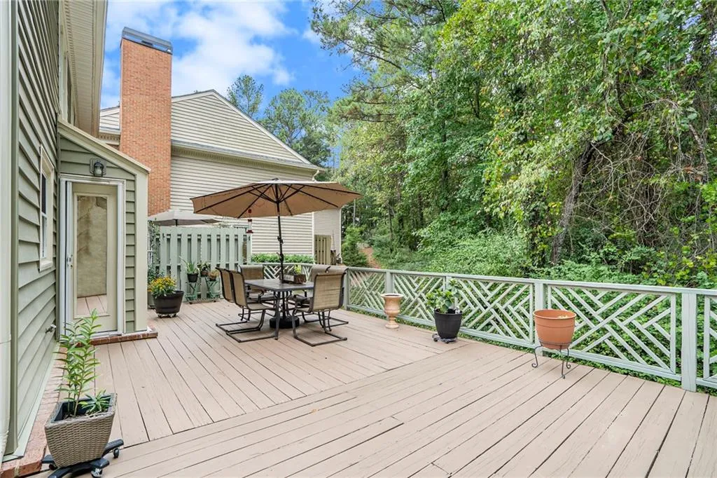Extra large deck with private wooded greenbelt behind the home that provides an amazing intown, yet in the woods, feeling