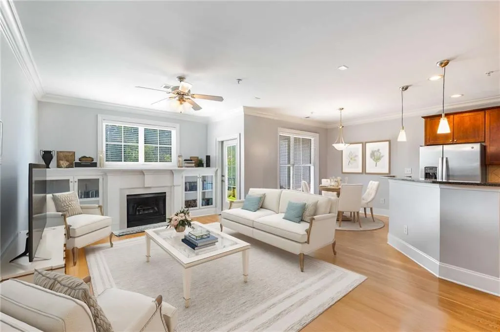 Fireside living room with built in bookshelves. Virtually staged