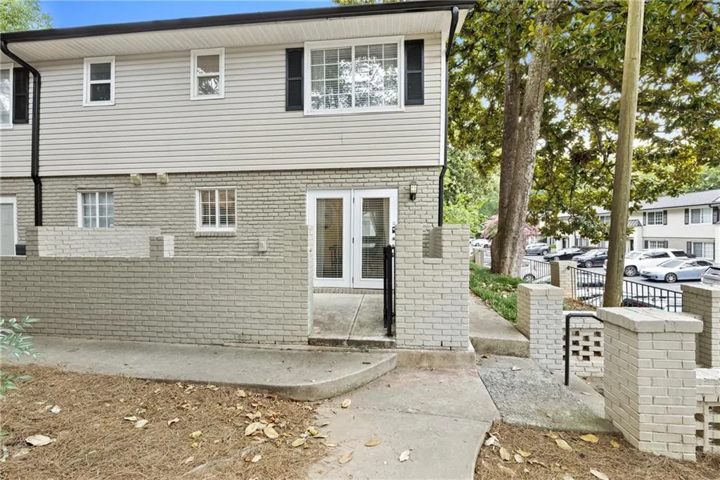 Rear view of house with brick siding