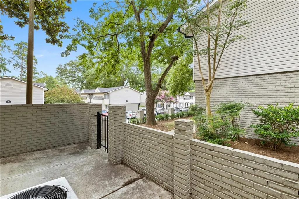 View of patio featuring a residential view and a gate