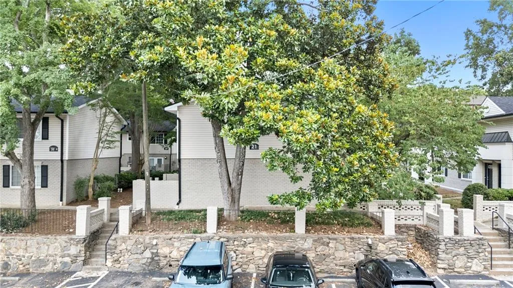 View of property's community with uncovered parking
