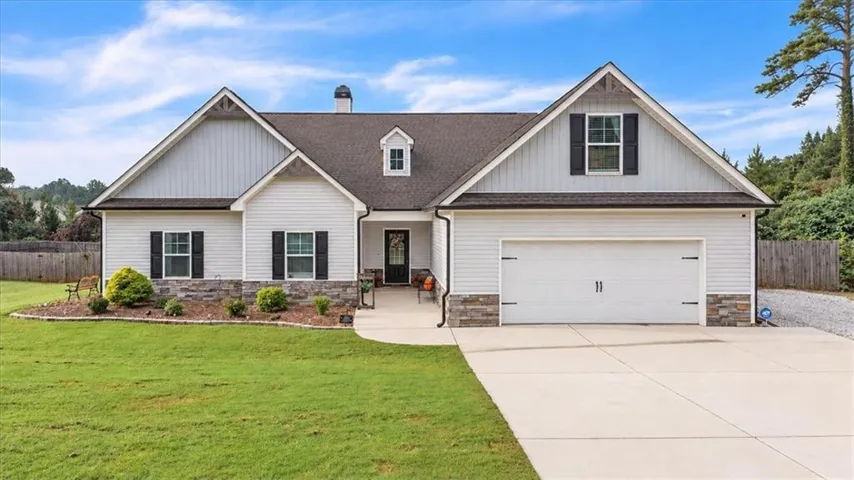 Craftsman-style facade with a two-car garage