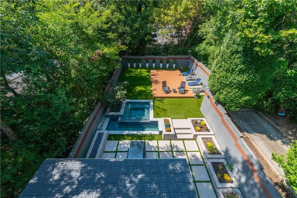 Outdoor area from roof top deck showing pool covered with sliding deck