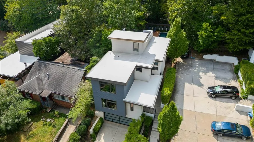 Aerial view showing 3rd parking space next to back yard area