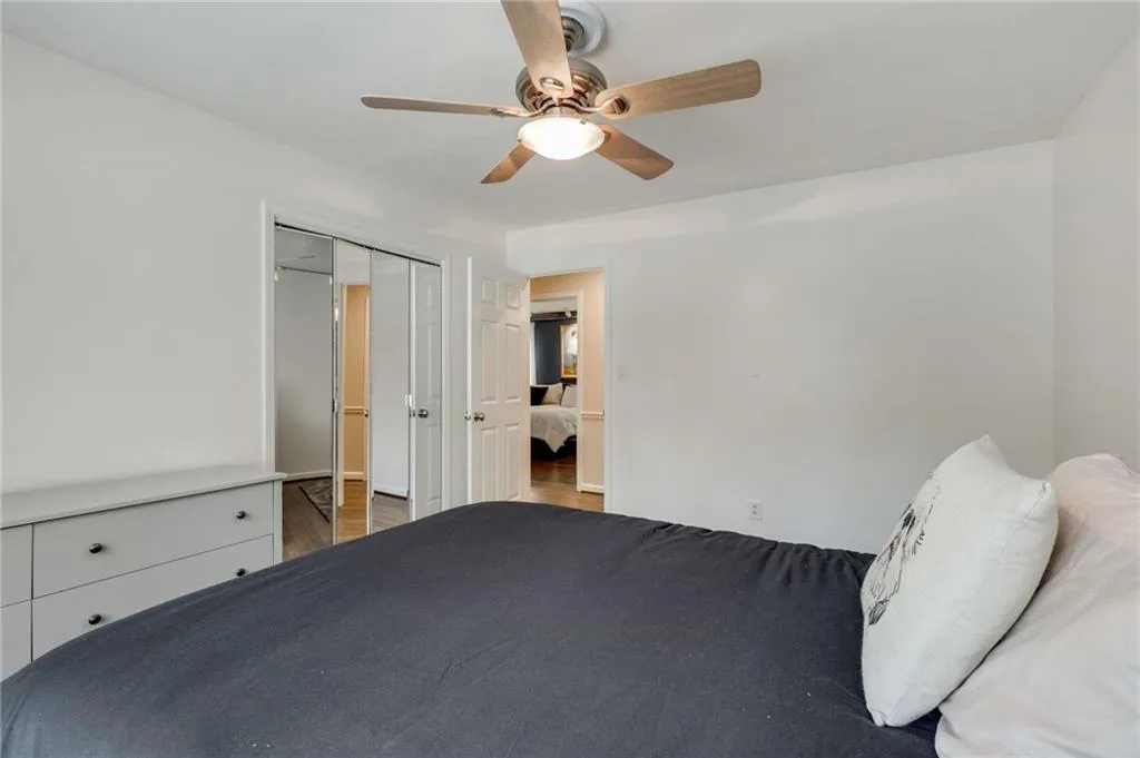 Secondary bedroom up with mirrowed closet doors