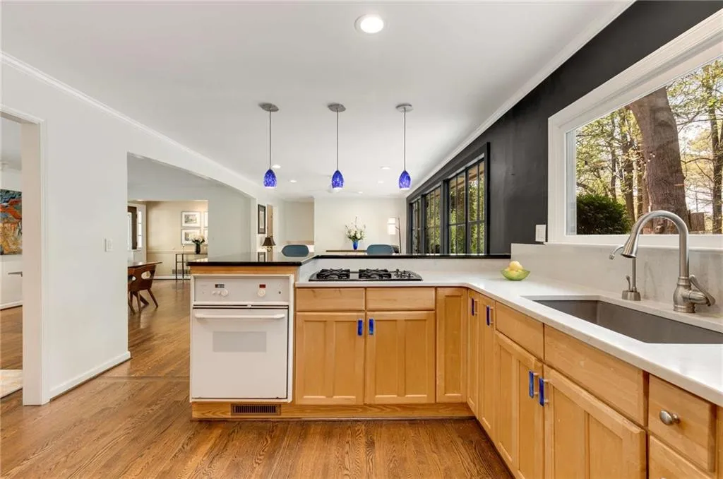 Work station in kitchen. Extra large rectangular sink.