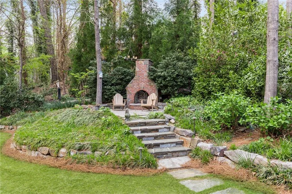 Enticing fireplace with overhead chandelier!