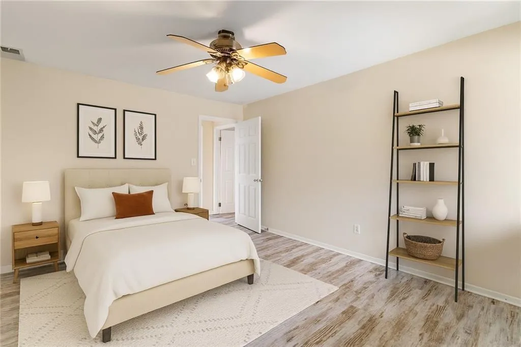 Bedroom with ceiling fan and light wood finished floors
