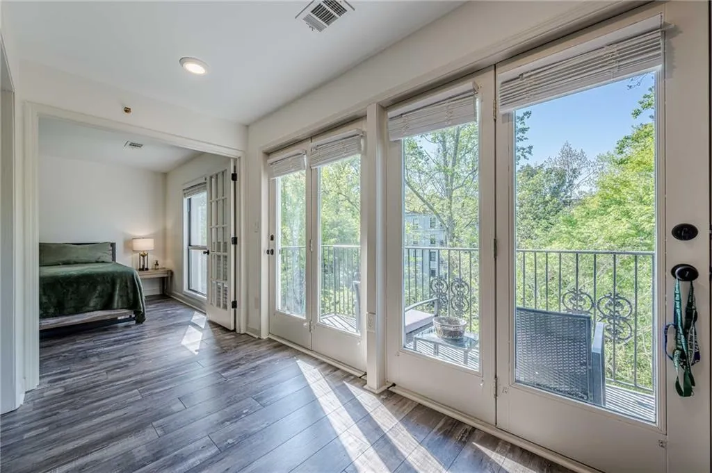 Entryway with wood finished floors and recessed lighting