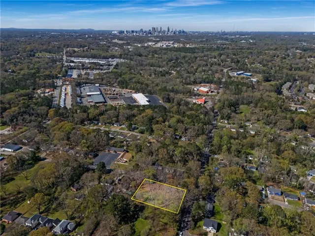 Aerial view of property's location featuring property boundaries highlighted and skyline