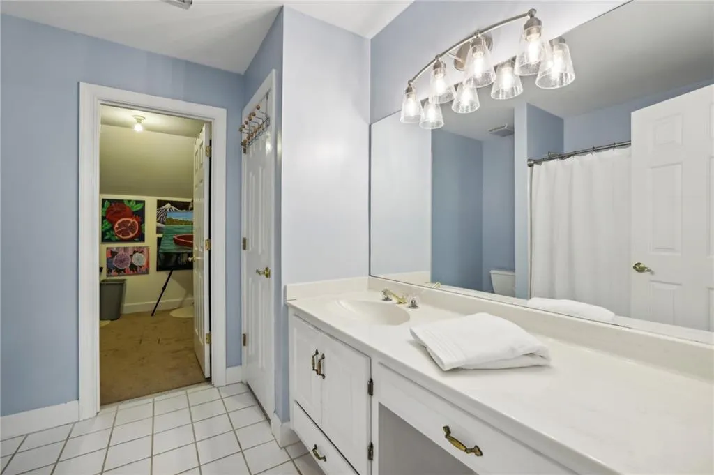 en suite bathroom to third bedroom upstairs, connects to a very large walk in closet