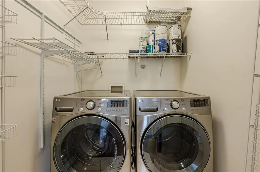 Washroom with washing machine and clothes dryer