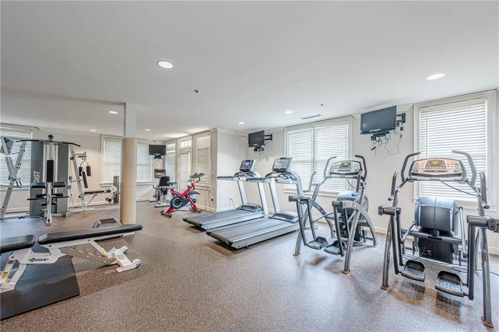 Workout area featuring healthy amount of natural light and recessed lighting