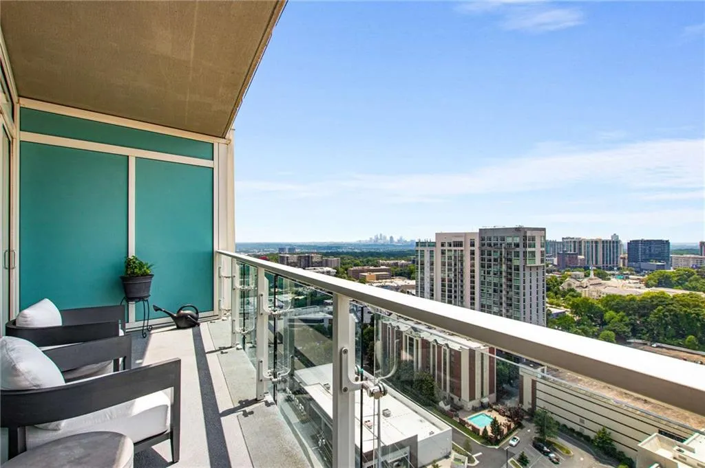 Balcony featuring a view of city