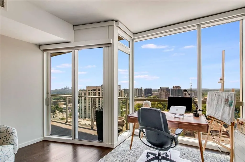 Office featuring healthy amount of natural light and dark wood-type flooring