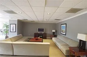 Living area featuring a paneled ceiling