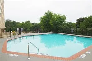 Community pool featuring a patio