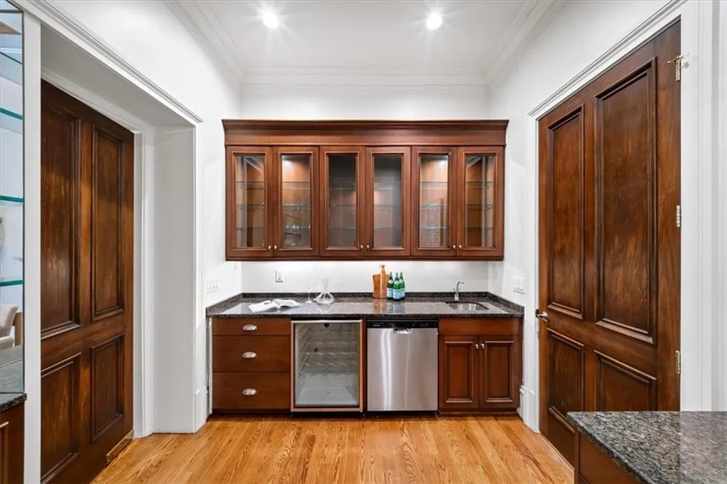 Combination bar and butler's pantry between kitchen and dining room