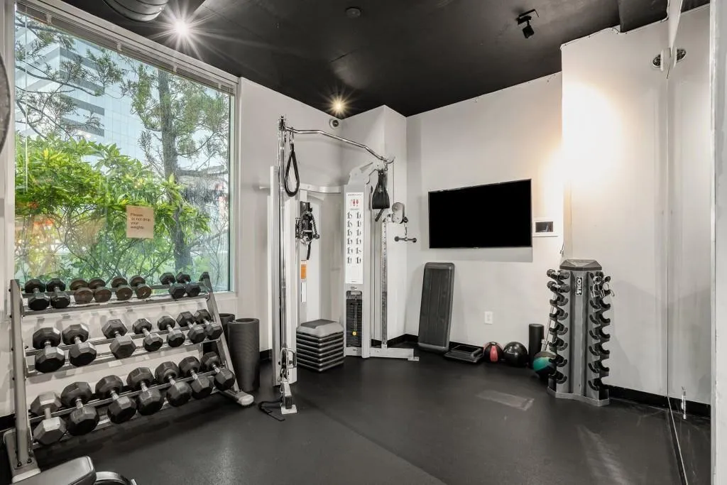 Realm Amenity - Two Story Fitness Center With Cardio Equipment And Weights