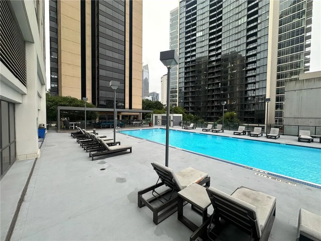 Community pool featuring a patio area