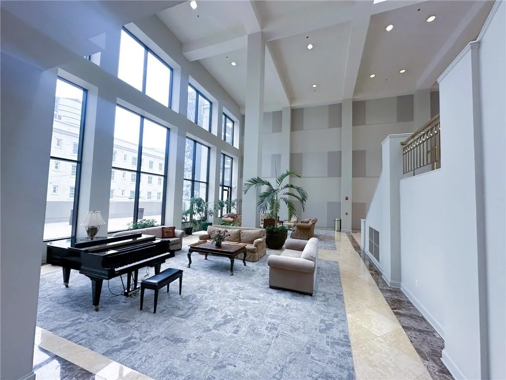 Lobby with recessed lighting, a towering ceiling, beamed ceiling, and coffered ceiling