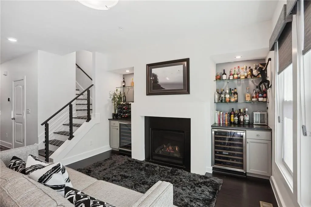 Living room with a wealth of natural light and gas fireplace