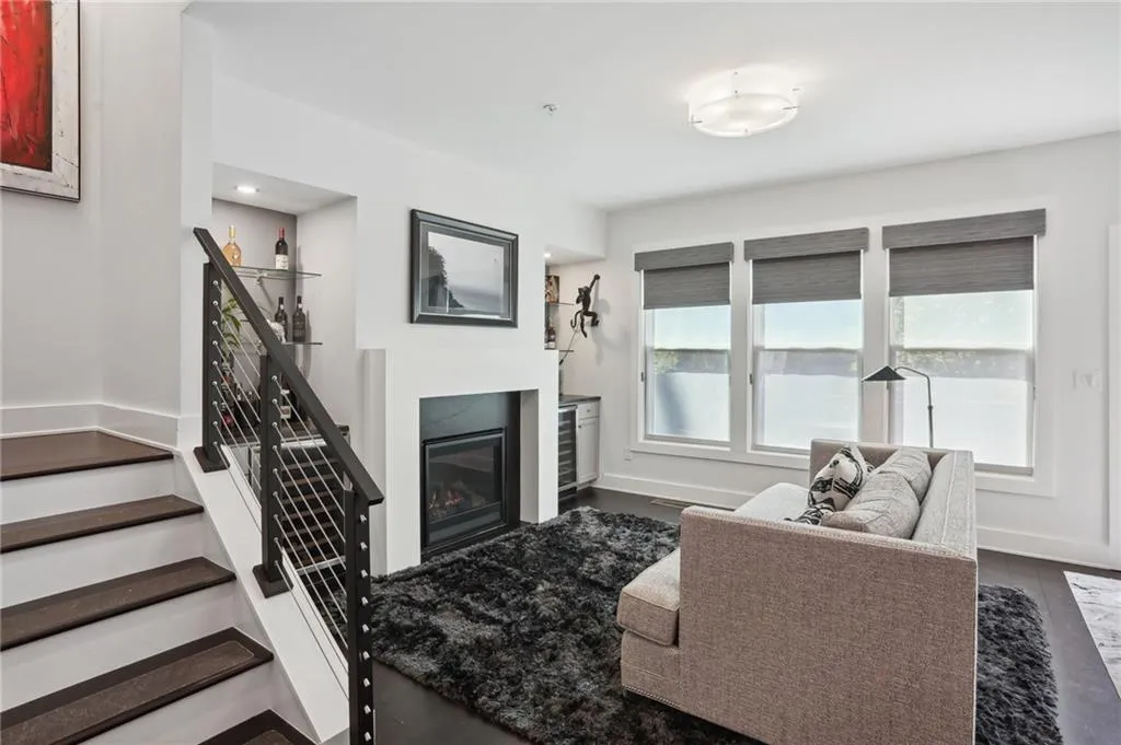 Living room featuring custom built in shelving and double beverage coolers.
