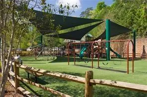 View of nearby Abernathy park featuring a playground