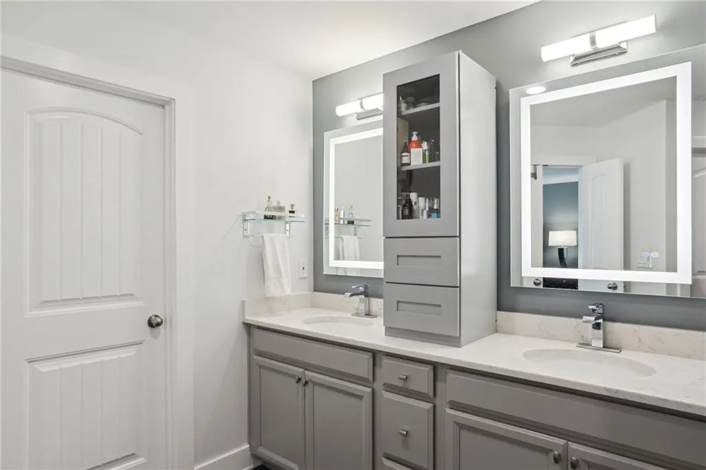 Bathroom featuring double sink vanity and tons of vanity storage