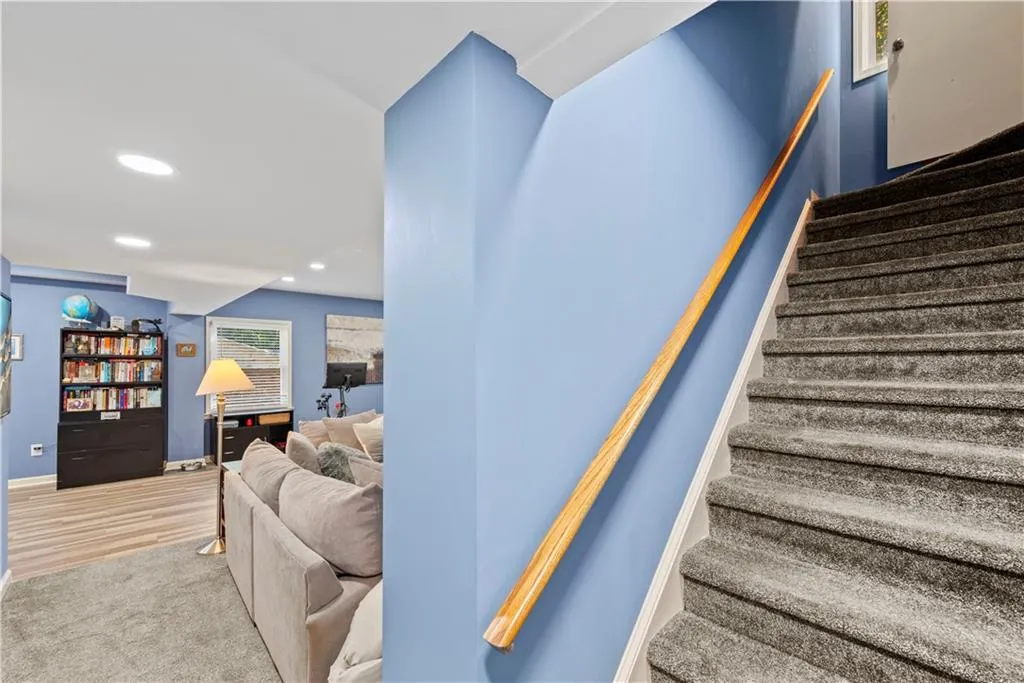 Staircase featuring recessed lighting and carpet flooring