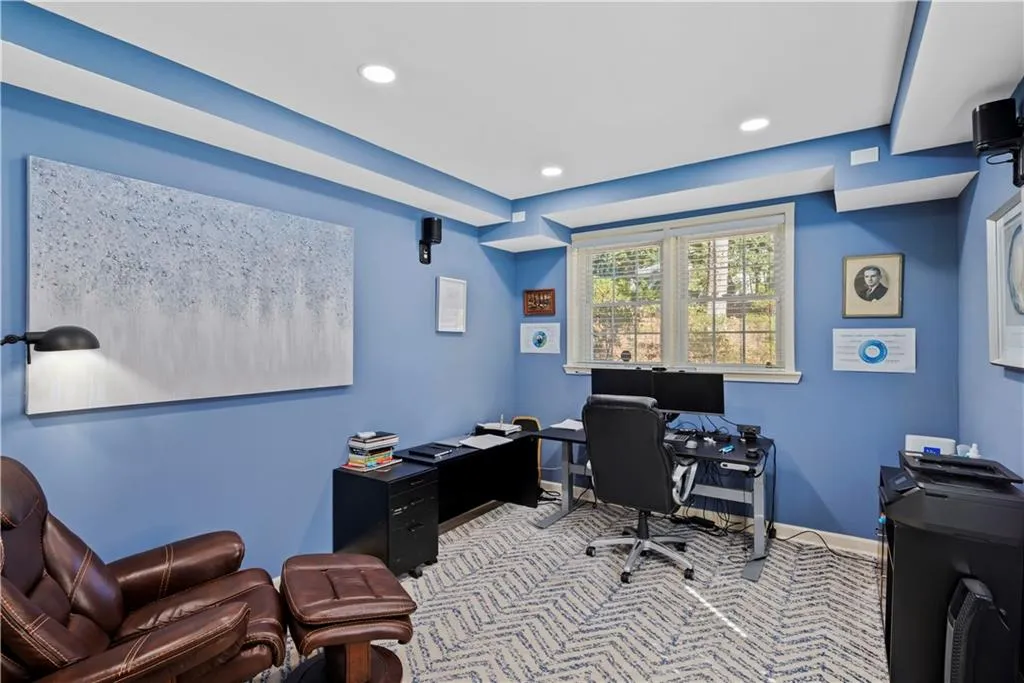 Carpeted office featuring recessed lighting and baseboards