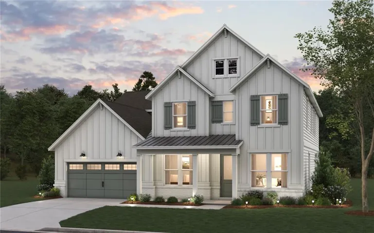 Modern farmhouse exterior with white board and batten siding, dark gray garage door, and a covered front porch