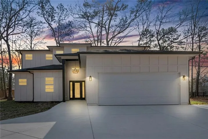 Contemporary architectural design featuring white horizontal siding and black trim accents