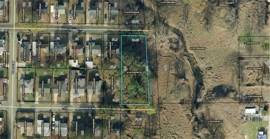Aerial overview of property's location with property parcel outlined