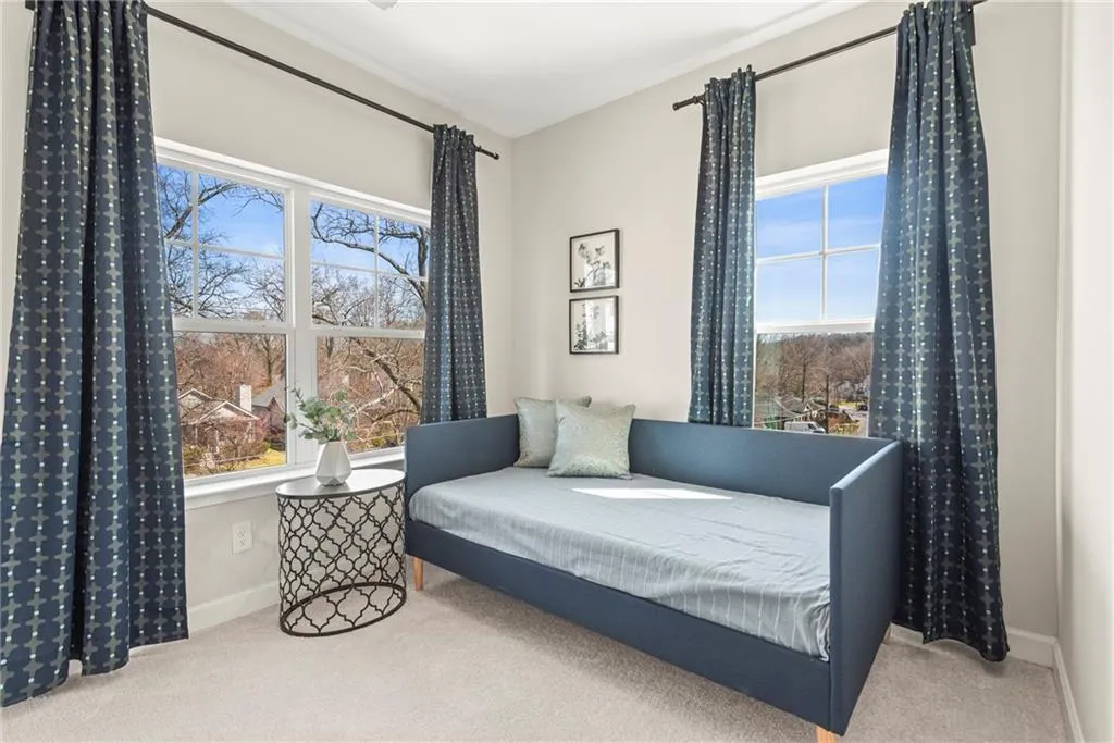 Sitting room with carpet flooring and baseboards