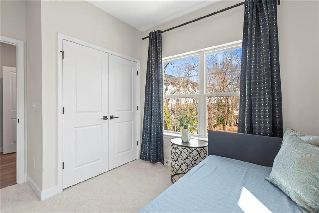 Bedroom with carpet and a closet
