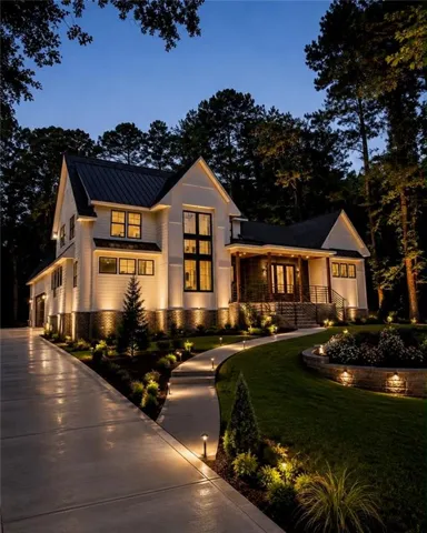 Modern farmhouse architecture with a dark metal roof and white siding