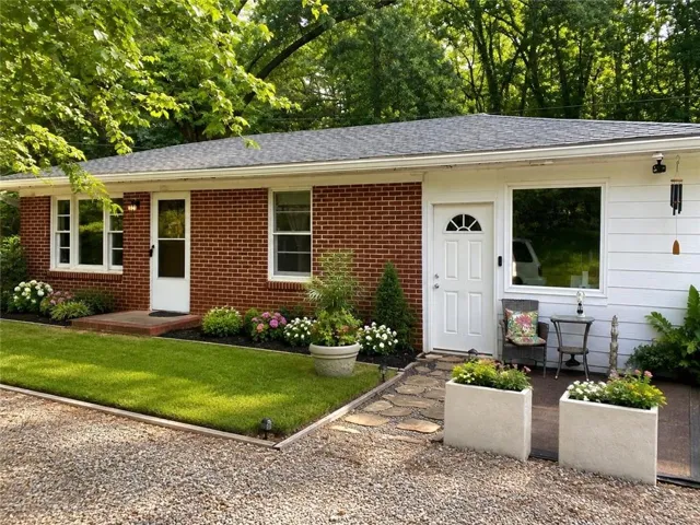 Brick and siding exterior with a shingle roof