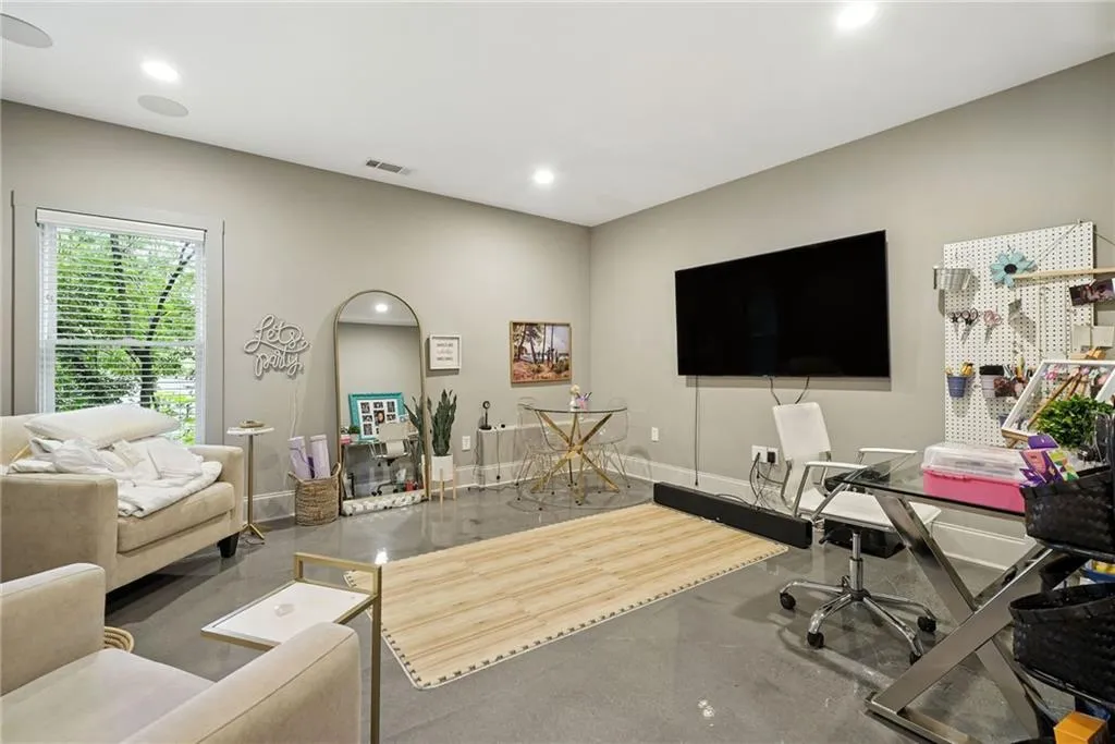 Office with baseboards and recessed lighting